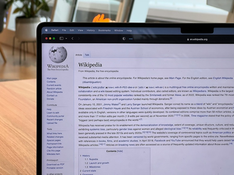 The Wikipedia article for Wikipedia shown on a laptop screen.