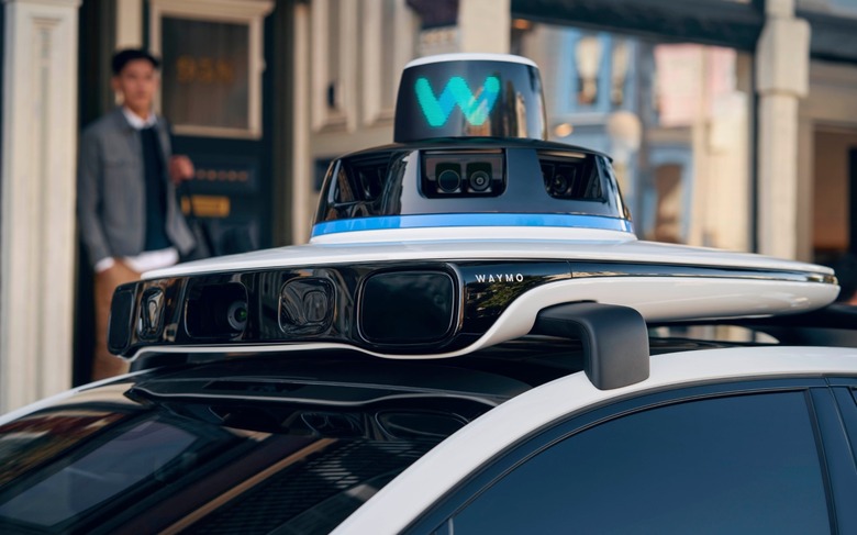 A car with sensors on its roof.