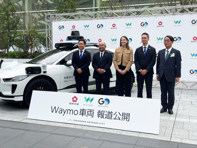 Executives from Alphabet's self-driving unit Waymo, Nihon Kotsu, Go, and East Japan Railway Company attend an event to showcase a Waymo vehicle that will be used for data collection in the Japanese capital, in Tokyo, Japan April 10, 2025. REUTERS/Daniel Leussink
