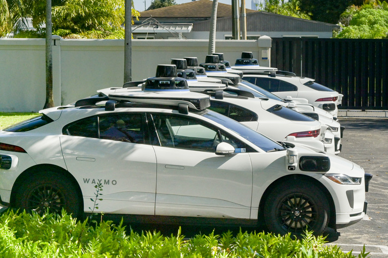 Miami, Florida, USA - 4 January 2025: Row of self-hail autonomous driving taxi cabs owned and operated by Waymo.