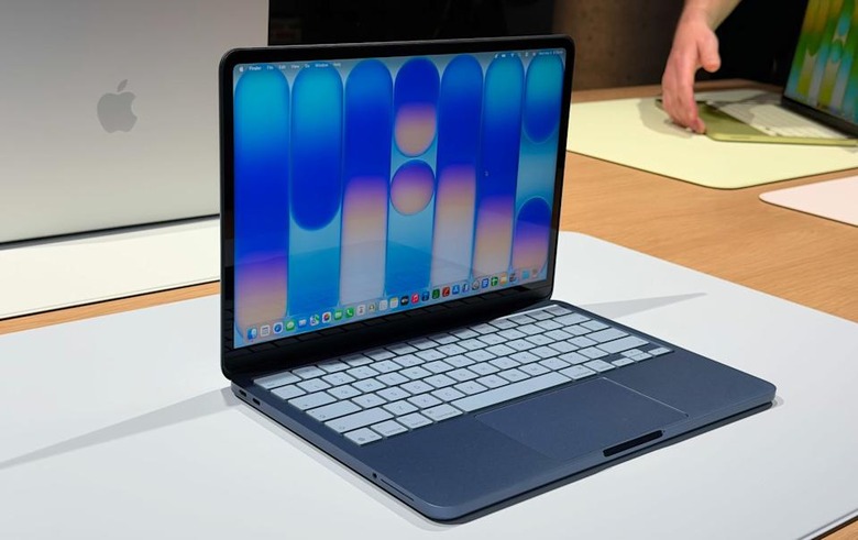 Image of the blue MacBook Neo sat on a table.