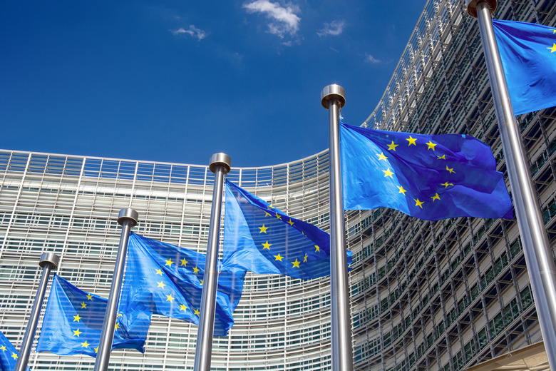 EU flags in front of the Berlaymont building, headquarters of the European Commission in Brussels, Belgium