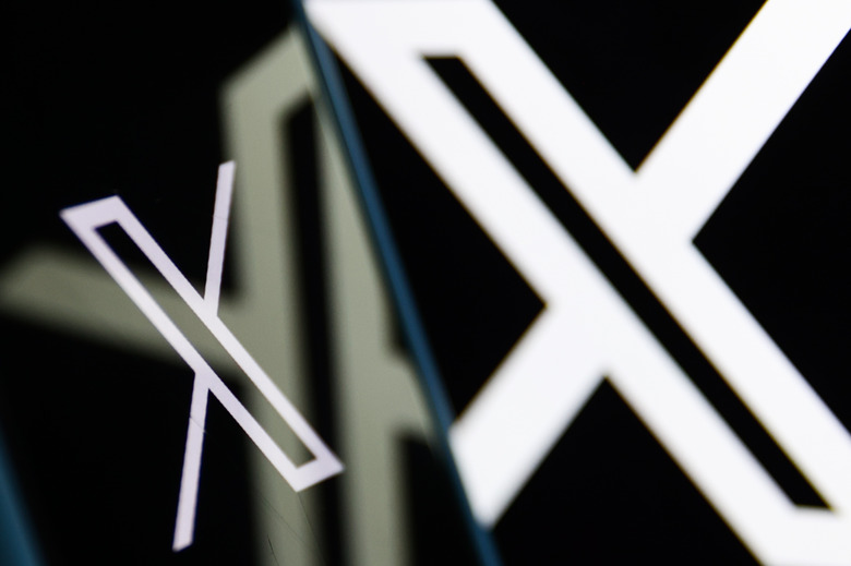 X logo displayed on a phone screen and X logo displayed on a laptop screen are seen in this illustration photo taken in Poland on July 24, 2024. (Photo by Jakub Porzycki/NurPhoto via Getty Images)