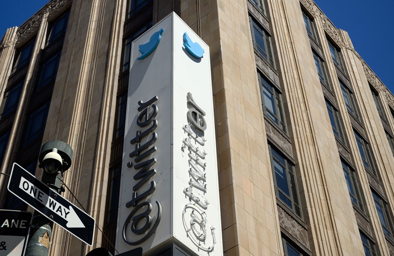Twitter's sign is seen partially removed after San Francisco Police stopped the changing of their sign to the company's new name, 