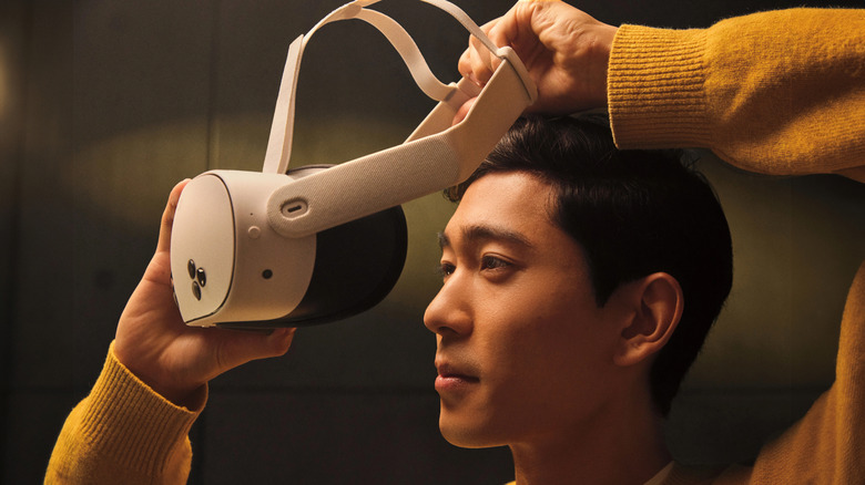 A man putting on the Meta Quest 3S VR headset.