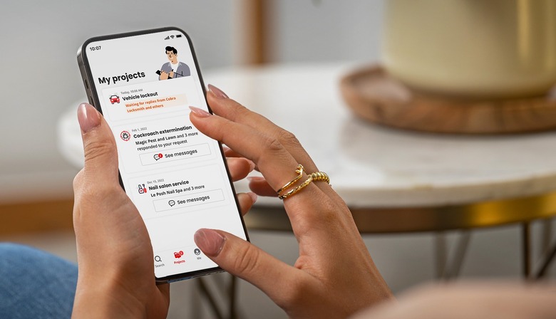 A person holds a smartphone while using Yelp's new Projects feature.