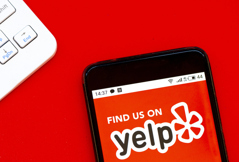 UKRAINE - 2020/04/07: In this photo illustration a Yelp logo seen displayed on a smartphone. (Photo Illustration by Igor Golovniov/SOPA Images/LightRocket via Getty Images)