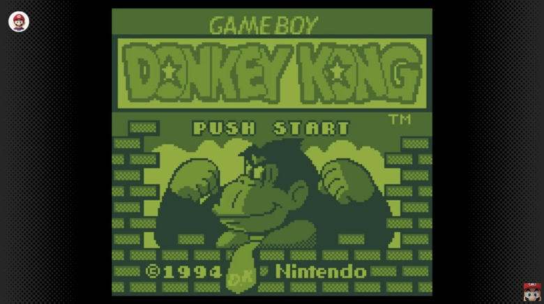 The title screen for the 1994 Game Boy game Donkey Kong, showing DK flexing his muscles surrounded by a brick wall