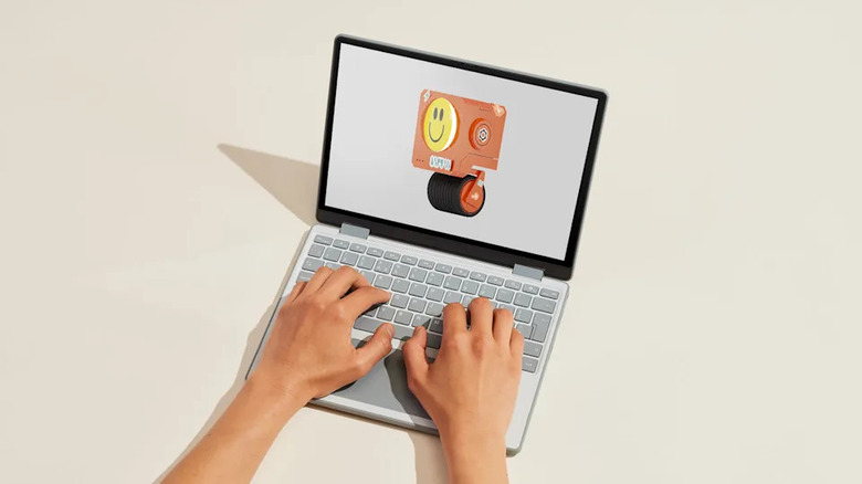 Marketing image of the Framework Laptop 12. Person typing on it.