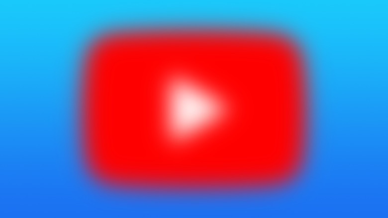 A blurred YouTube logo on a blue gradient background.