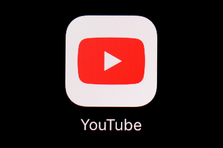 FILE - The YouTube app is displayed on an iPad in Baltimore. Police said Wednesday, Jan. 31, 2024, that they charged Justin Mohn, 32, with first-degree murder and abusing a corpse after he beheaded his father, Michael, in their Bucks County, Pa., home and publicized it in a 14-minute YouTube video that anyone, anywhere could see. (AP Photo/Patrick Semansky, File)