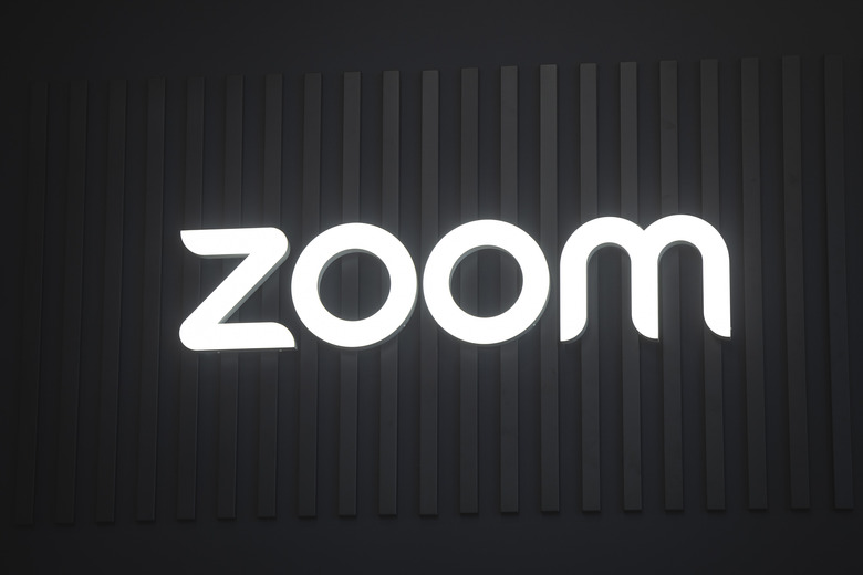 BARCELONA, SPAIN - FEBRUARY 4: A logo sits illuminated outside the Zoom booth at ISE 2025 on February 4, 2025 in Barcelona, Spain. Integrated Systems Europe (ISE), the second largest professional congress to be held in Barcelona this year, expects to attract more than 80,000 attendants. ISE occupies the entire Fira Barcelona space and has more than 1,600 exhibiting companies. One of the major novelties this year is the installation of an area dedicated to eSports. (Photo by Cesc Maymo/Getty Images)