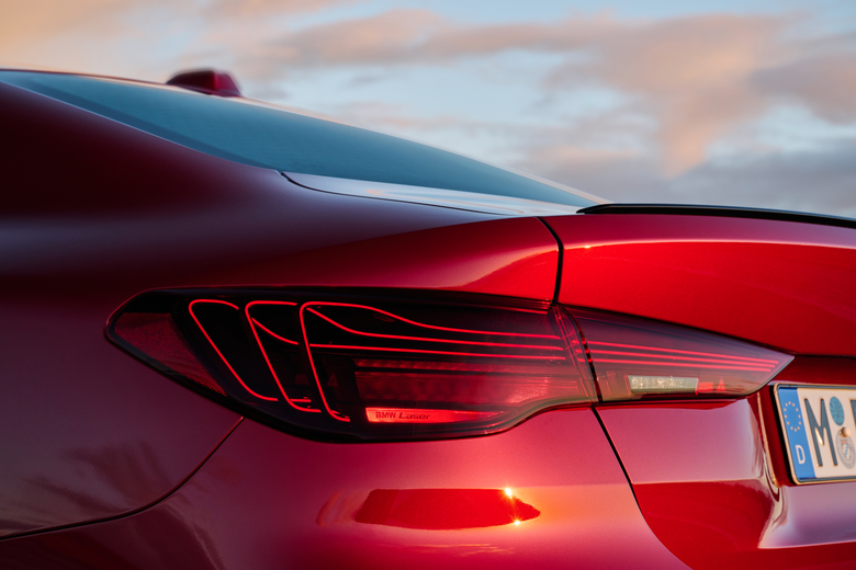 The new front and rear lights on a red BMW M440i