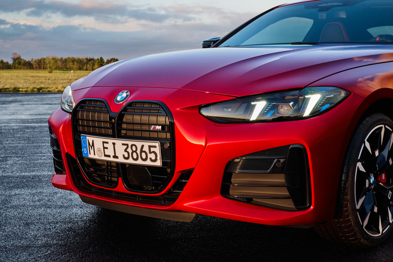 The new front and rear lights on a red BMW M440i